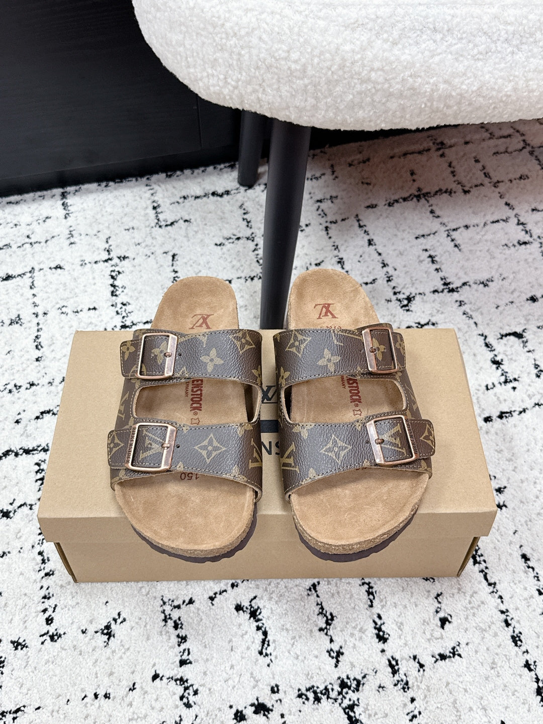 Louis Vuitton monogram slide sandals with two buckles, tan footbed.