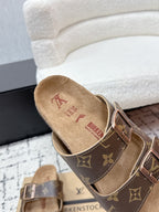 Louis Vuitton monogram slide sandals with adjustable buckle straps, suede footbed.