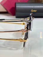 Close-up of gold-tone Cartier eyeglass frame hinge and temple with black case