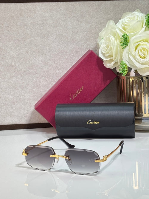 Rectangular gold-tone Cartier eyeglass frame with gray gradient lenses and black temples