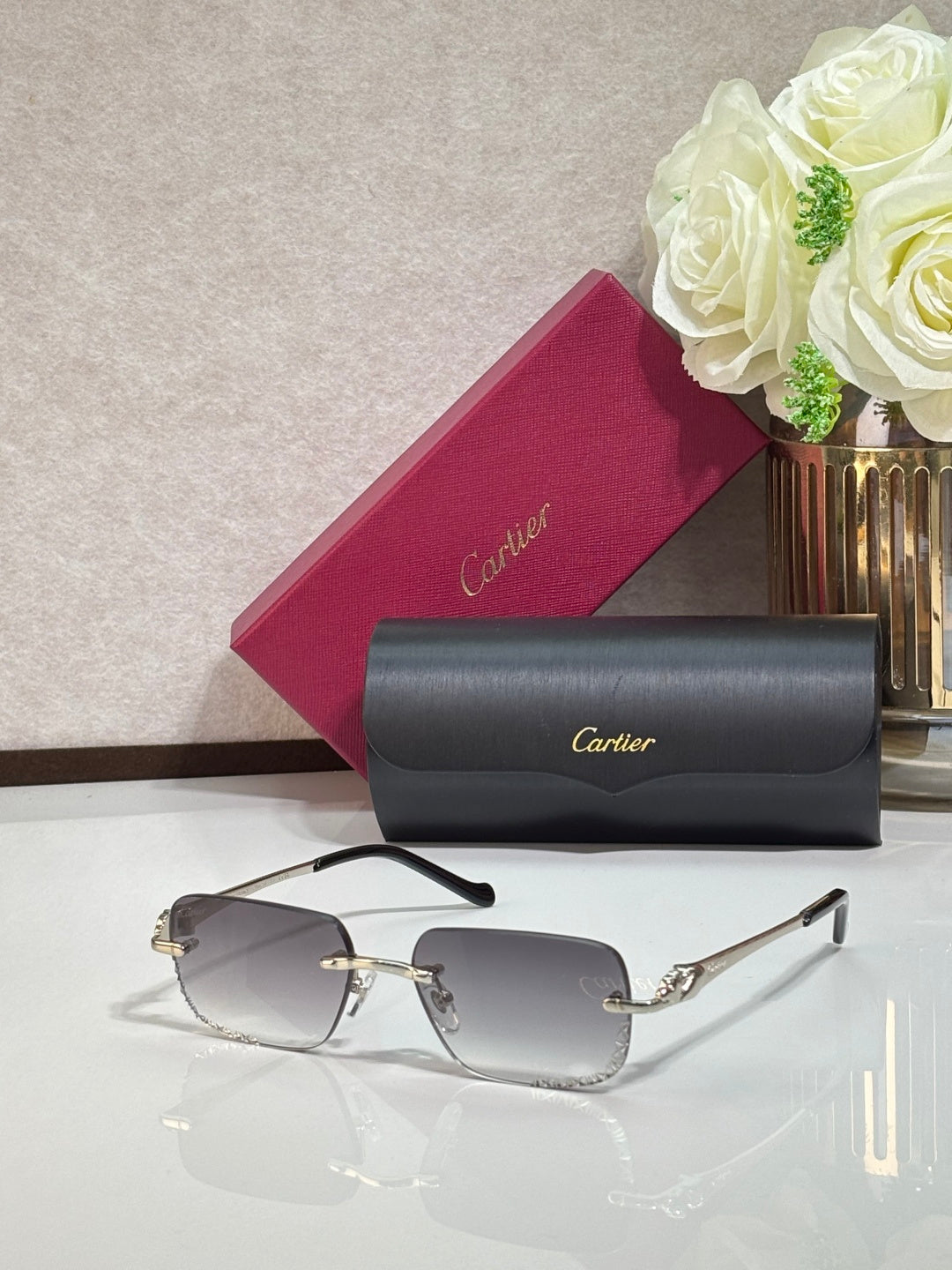 Cartier eyeglasses with gold temples and clear rectangular lenses
