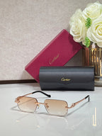 Cartier eyeglasses with gold metal temples and light brown tinted rectangular lenses