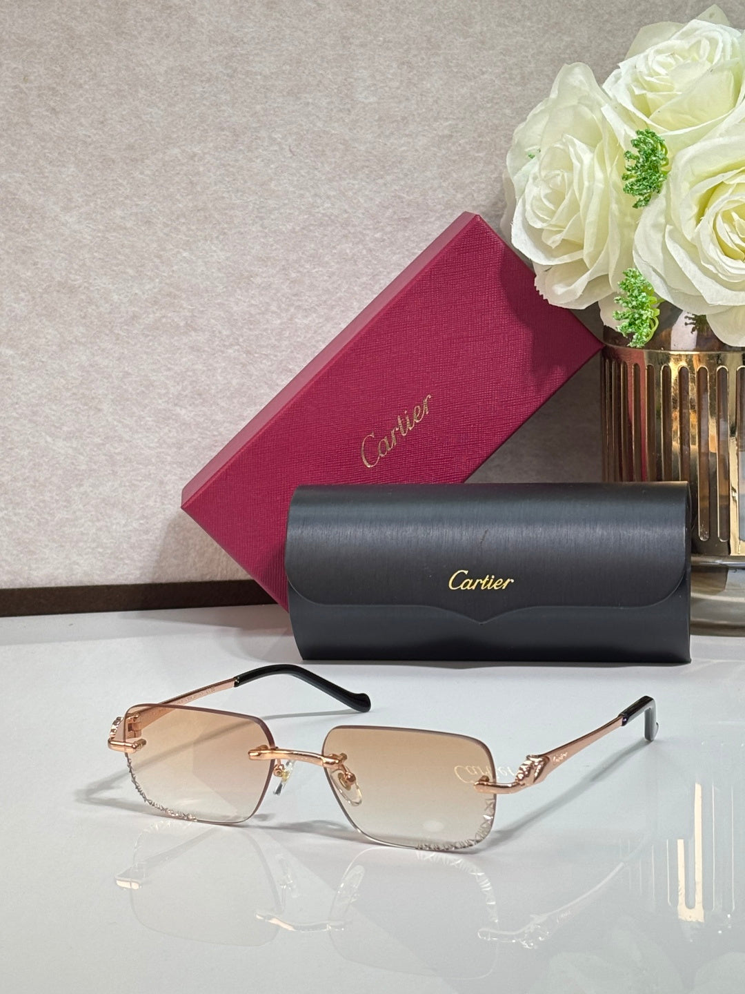 Cartier eyeglasses with gold metal temples and light brown tinted rectangular lenses