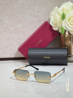 Cartier glasses with gold metal temples and amber tinted rectangular lenses