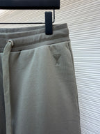 Amiri shorts front detail, light gray with small embroidered logo on pocket area