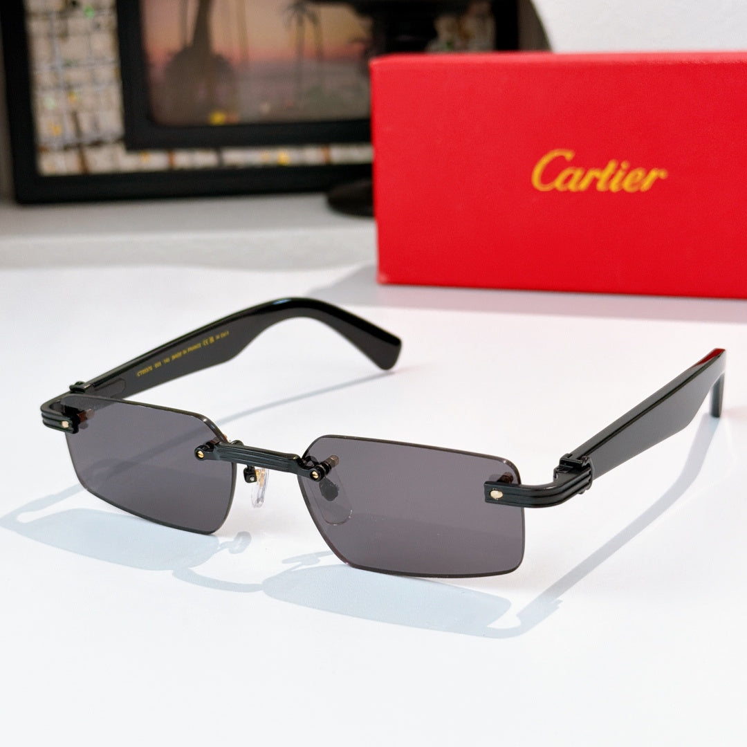 Sunglasses with dark gray lenses, black frame, and gold metal arms.