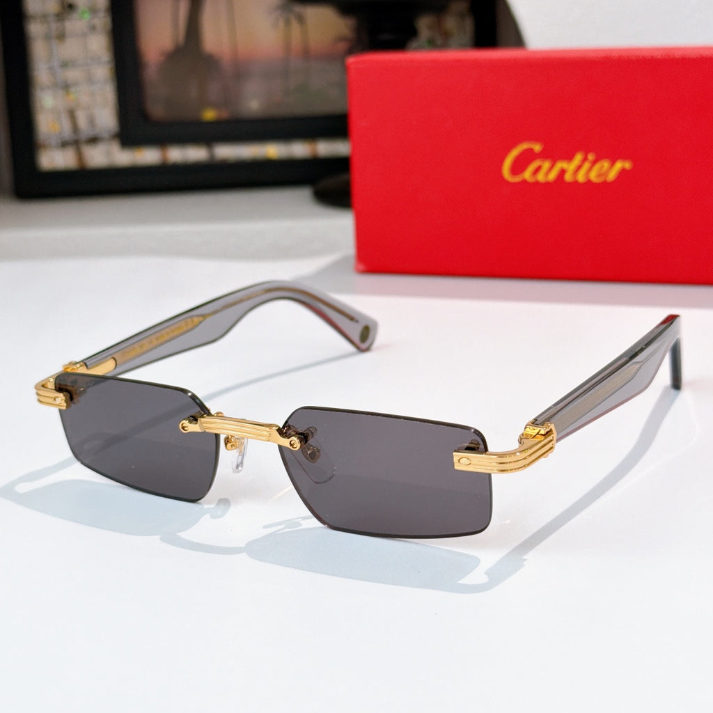 Sunglasses with gray lenses, tortoise temples, and gold metal details.