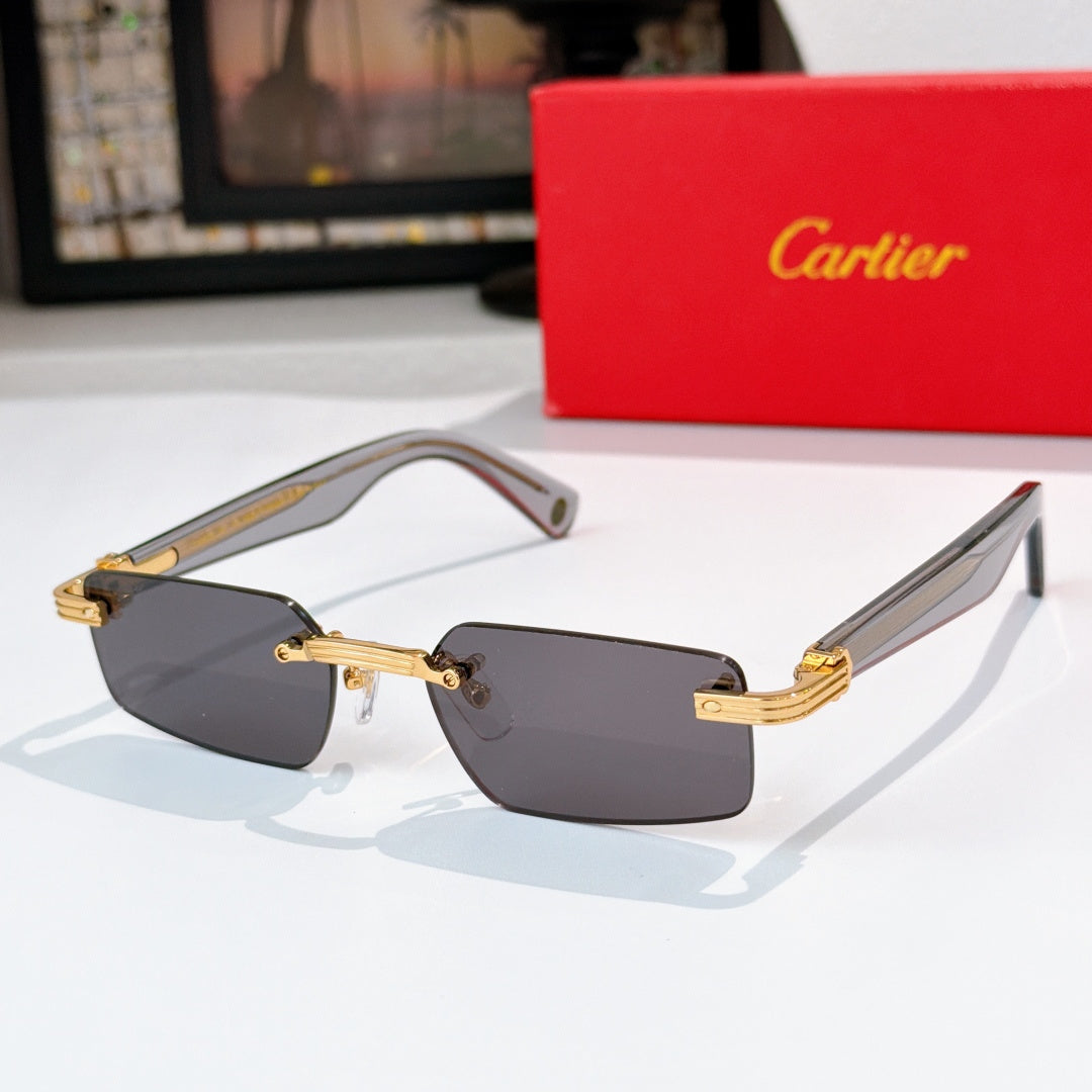 Sunglasses with gray lenses, tortoise temples, and gold metal details.