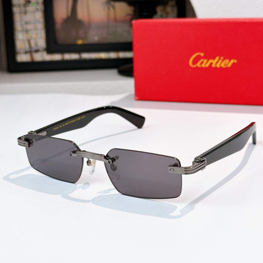 Sunglasses with dark gray lenses and black frame with silver metal arms.