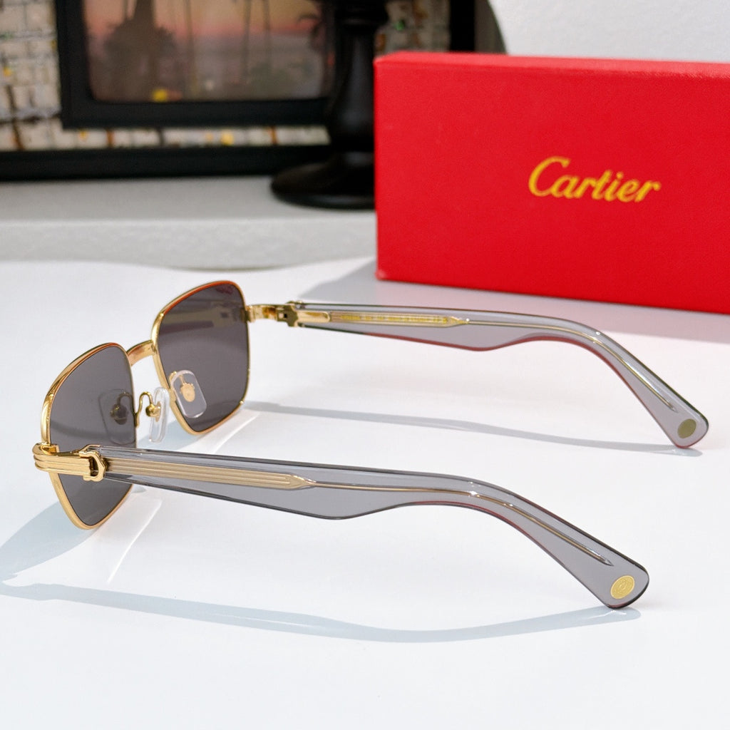 Cartier sunglasses with brown lenses and gold-tone frames with translucent arms