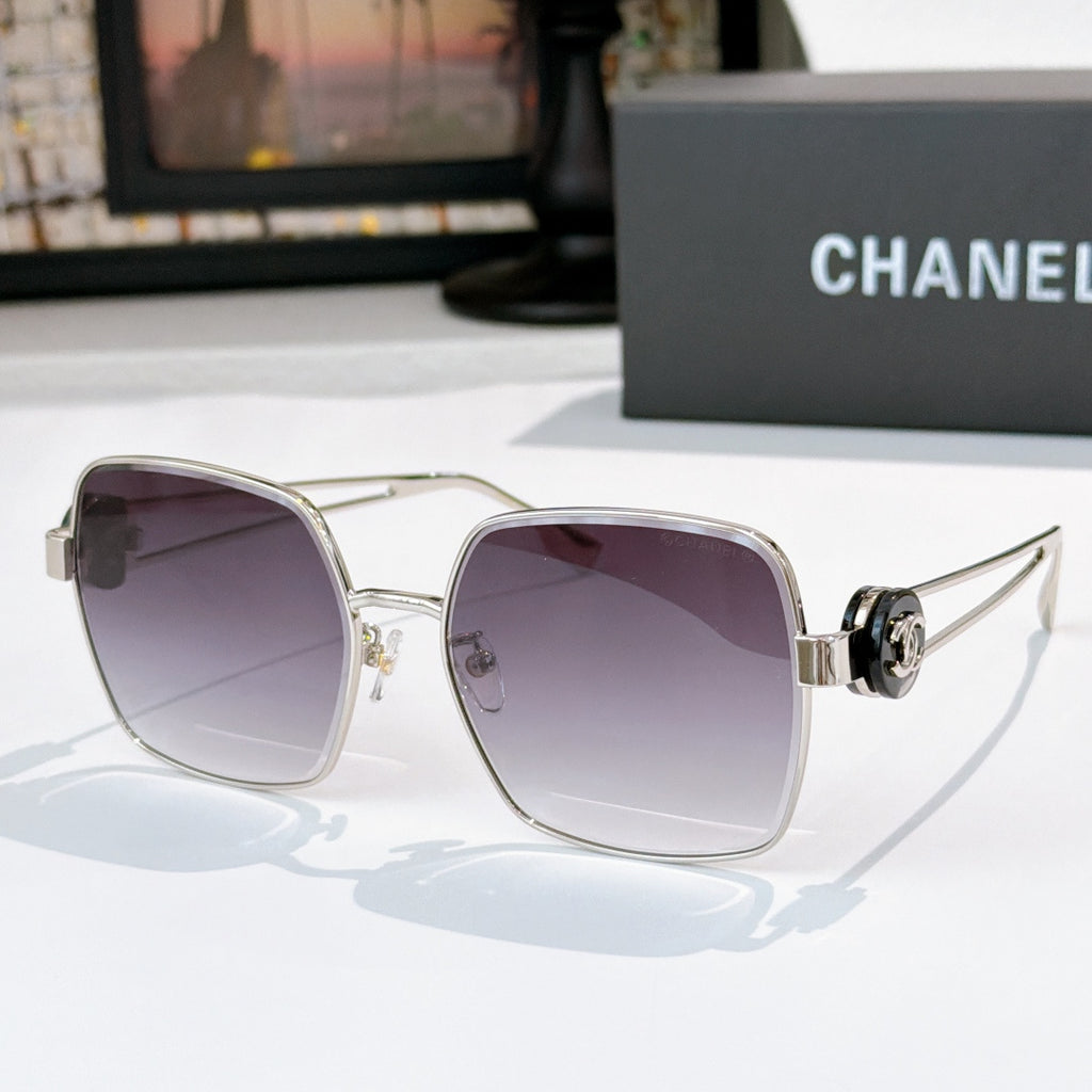 Chanel silver-tone sunglasses with purple gradient square lenses and logo hinge detail.