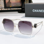 Chanel silver-tone sunglasses with purple gradient square lenses and logo hinge detail.