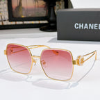 Chanel gold-tone sunglasses with pink square lenses and round logo hinge detail.