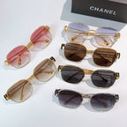 Assorted sunglasses with colored lenses, including pink, brown, and dark frames