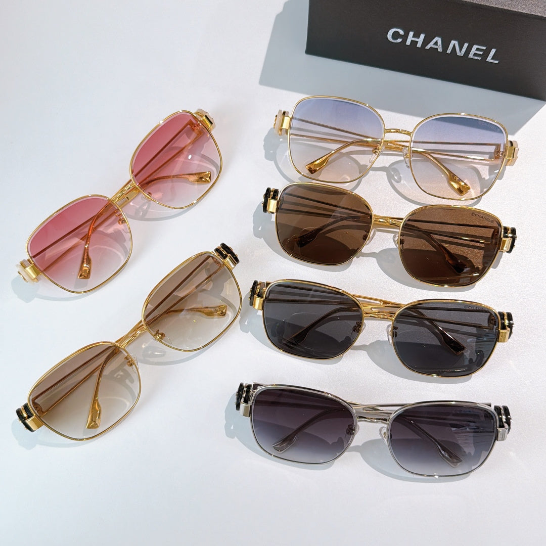 Assorted sunglasses with colored lenses, including pink, brown, and dark frames