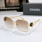 Gold-frame sunglasses with light brown tinted lenses and curved cat-eye frame