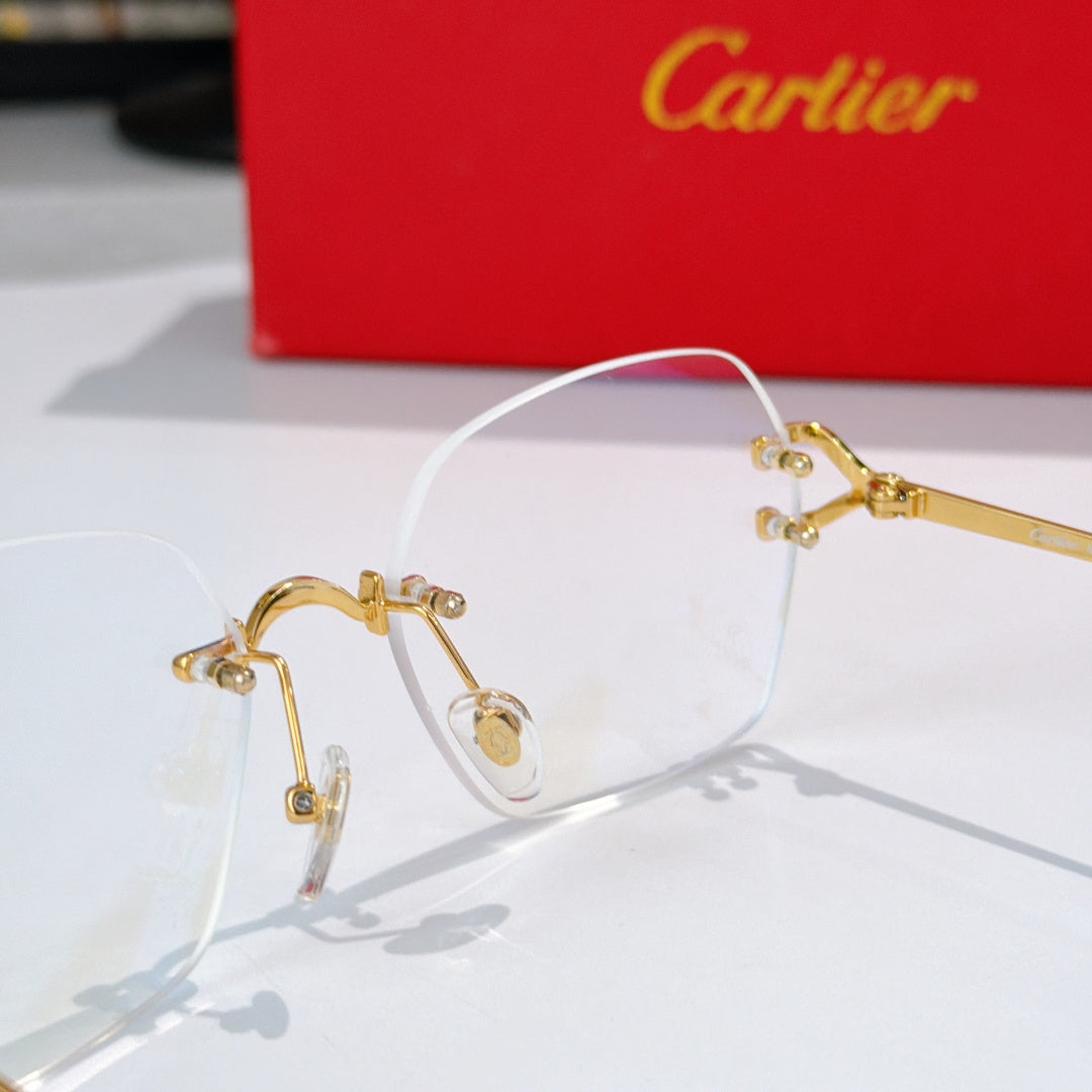 Gold-tone metal eyeglasses with clear lenses and small rhinestone details