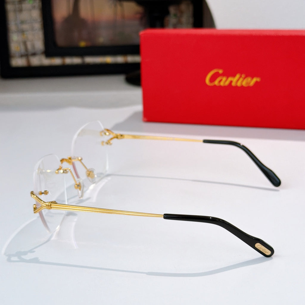 Gold-tone metal eyeglasses with clear lenses and black temple tips
