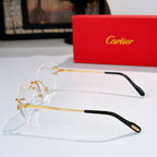 Gold-tone metal eyeglasses with clear lenses and black temple tips