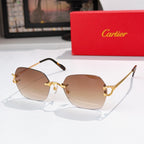 Cartier glasses with black frame, gold metal details, taupe tinted lenses