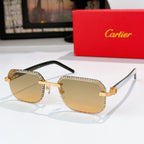 Cartier sunglasses with silver-tone patterned frame, gold accents, light amber lenses