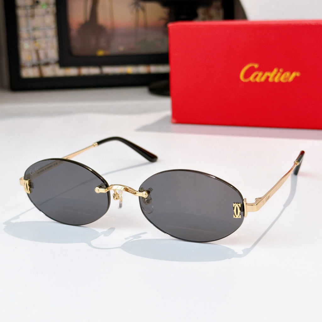 Cartier sunglasses with gold frame and dark gray lenses, rounded oval shape