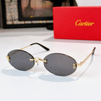 Cartier sunglasses with gold frame and dark gray lenses, rounded oval shape