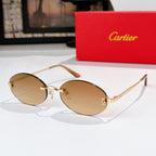 Cartier eyeglasses with gold frame and amber tinted lenses, oval rounded silhouette