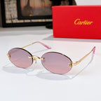 Cartier sunglasses with gold frame and pink tinted lenses, rounded oval profile
