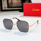 Gold-tone metal glasses with dark gray lenses, hexagonal frames and metal temples