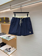 Moncler navy drawstring shorts with cream waistband and white tie cords