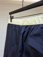 Moncler navy shorts with cream waistband and side patch pocket detail