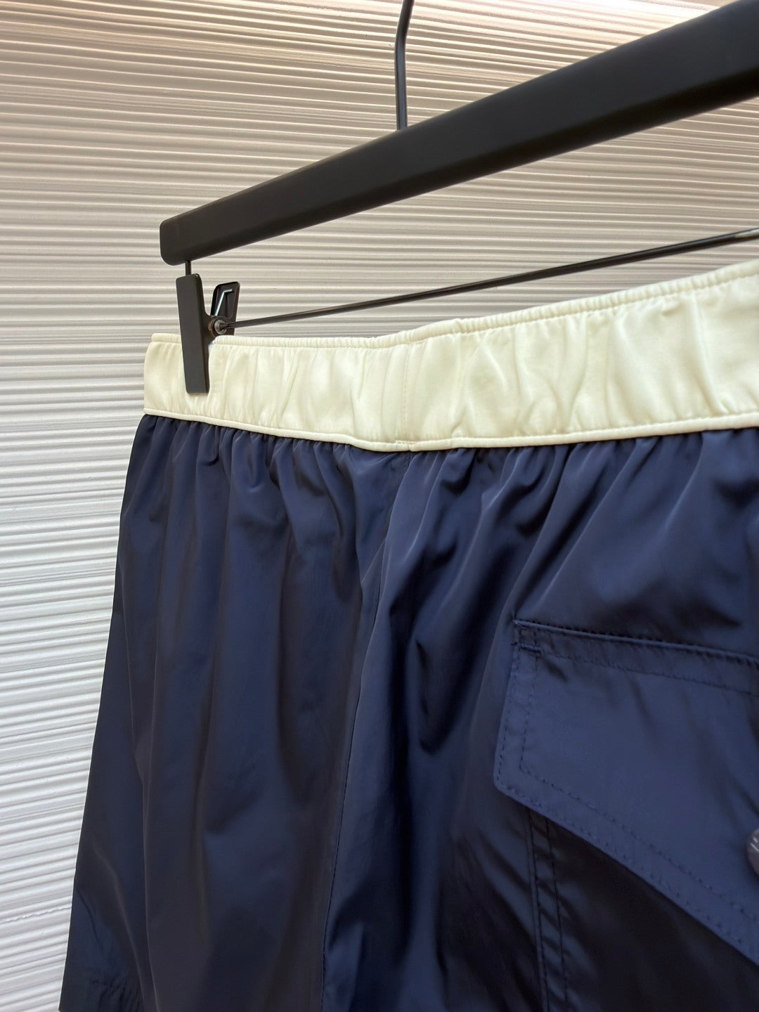 Moncler navy shorts with cream waistband and side patch pocket detail