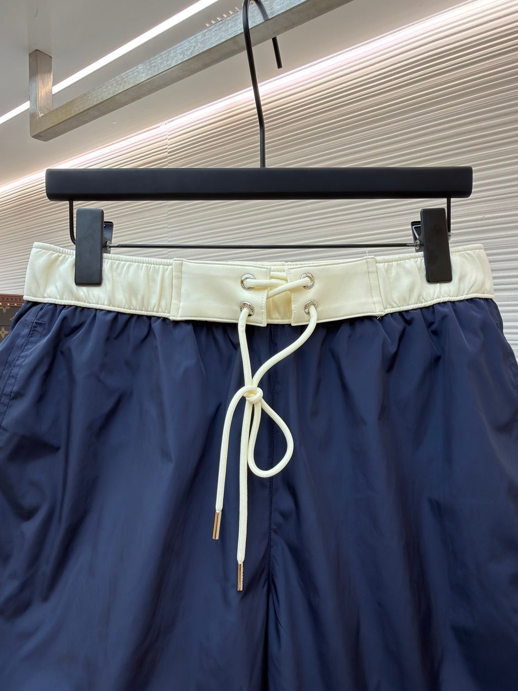 Moncler navy shorts with cream elastic waistband and white drawstring cords