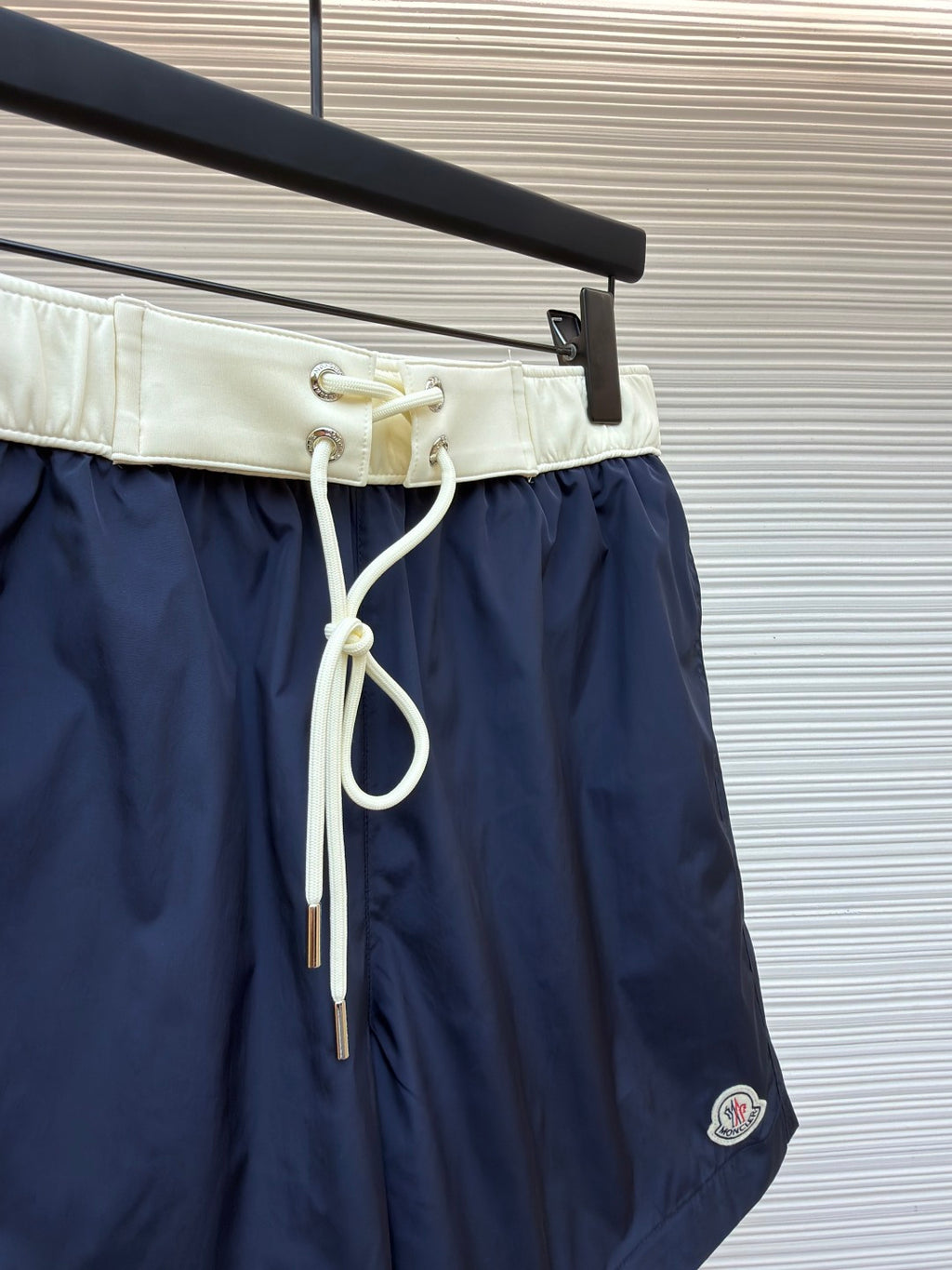 Moncler navy shorts with cream waistband and long white drawstring cords