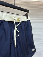 Moncler navy shorts with cream waistband and long white drawstring cords