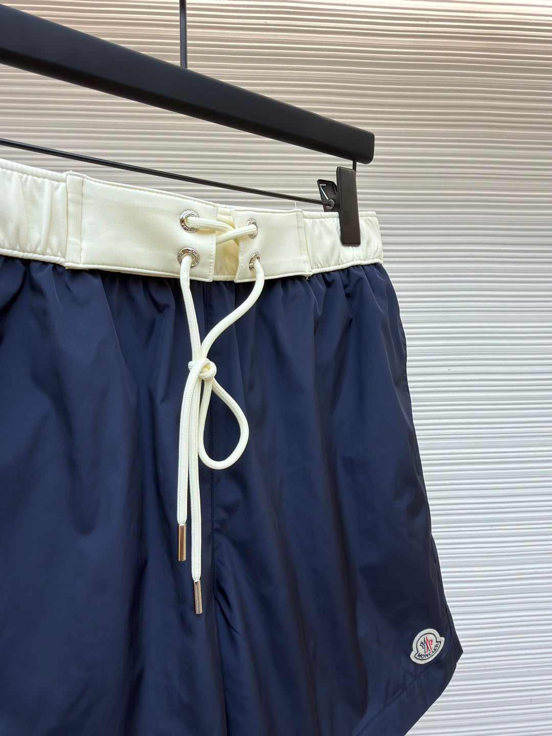 Moncler navy shorts with cream waistband and long white drawstring cords
