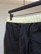 Moncler dark navy swim shorts with pale waistband and back pocket detail