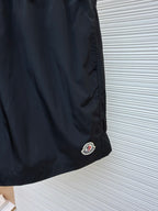 Moncler dark navy swim shorts with side logo patch near the hem
