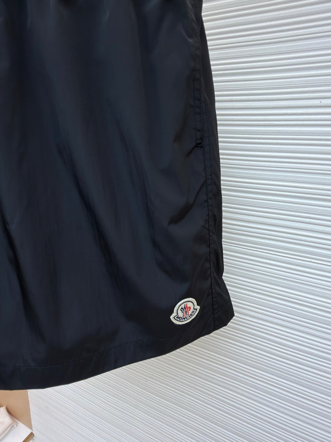Moncler dark navy swim shorts with side logo patch near the hem