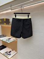 Moncler dark navy swim shorts with pale waistband and side cargo pocket