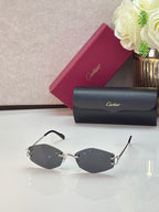 Gold metal sunglasses with dark lenses and black temple tips, front view