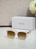 Rose sunglasses with gold logo hardware and tinted light-brown lenses
