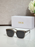 Silver-tone sunglasses with gold logo hardware and dark lenses
