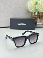 Chrome glasses with black frames and dark lenses, glossy finish
