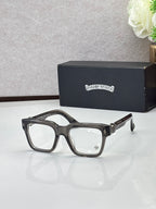 Dark eyeglasses with square frames, gold-tone temple detail and clear lenses