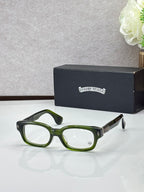 Green oval glasses with clear lenses and dark temple accents