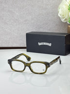 Olive green oval glasses with clear lenses and gold temple accents