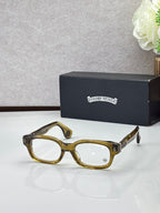 Olive green oval glasses with clear lenses and gold temple detail