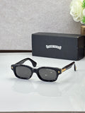 Black oval sunglasses with dark lenses and gold detail on the temples